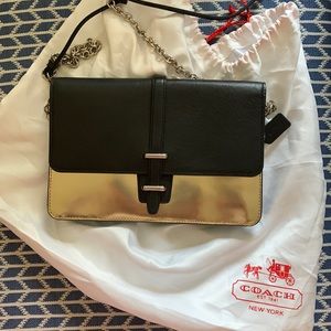 Coach black and gold crossbody purse